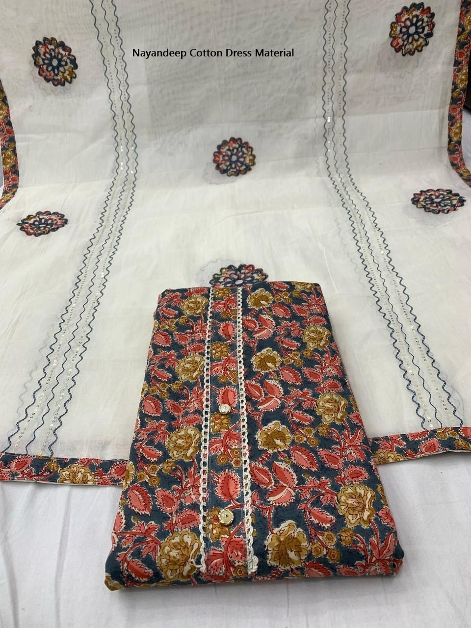 Kumkum 300425 Nayandeep Cotton Dress Material Wholesaler India