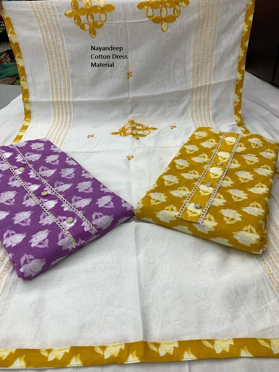 Kumkum 300425 Nayandeep Cotton Dress Material Wholesaler India